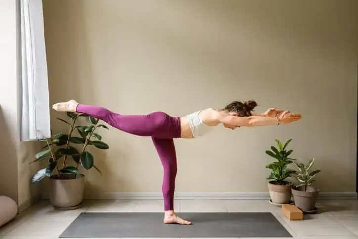 Achieving the Perfect Tone: How Often Should You Exercise for Results? 1 Woman doing Yoga exercise Felixstowe to help with toning the body.