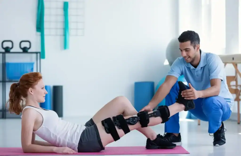 Woman having treatment to help muscle recovery Felixstowe after an injury